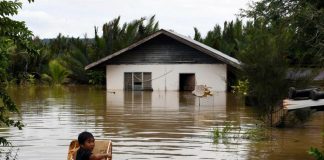 Stagnant floodwaters making it difficult to channel aid to victims