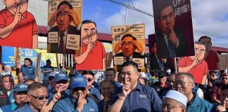 Sepanduk karikatur: Mereka saja boleh, orang lain salah?